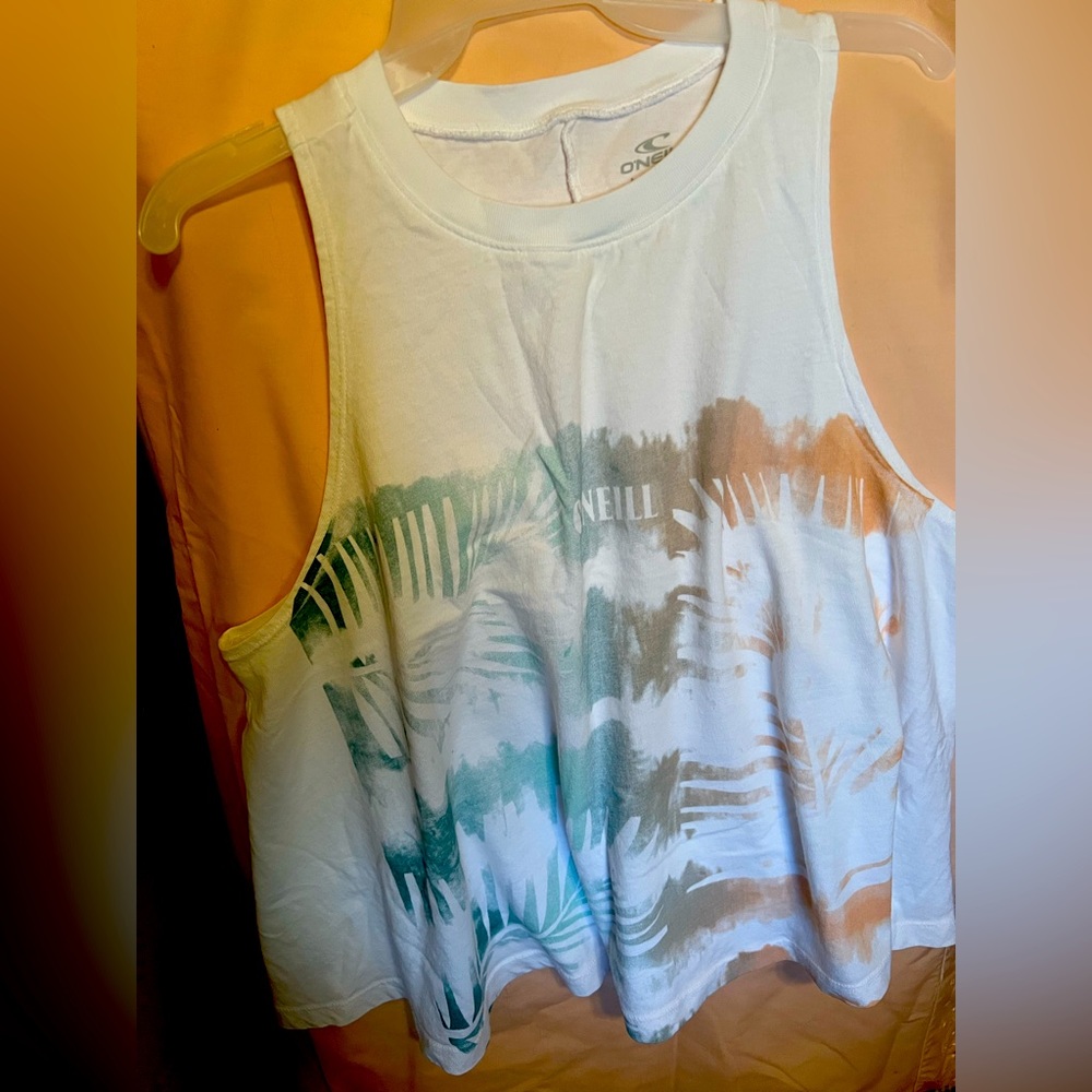 Sleeveless muscle tee flared at bottom .   Worn once